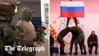 Russian troops hand flowers to women in occupied Ukraine in International Womens Day stunt