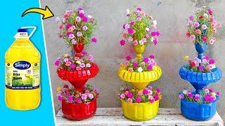 Recycling Plastic Bottles into Vertical Gardens Beautiful Rainbow Flower Tower