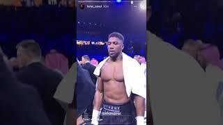 Anthony Joshua fuming as Lomachenko attempts to console him in the ring after the Usyk defeat