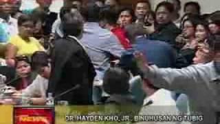 ex-copAbner Afuang splashes water on Dr.Hayden Khos Head at Senate hearing