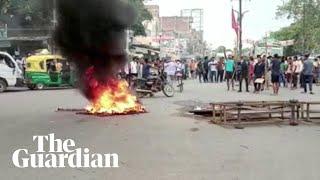 Trains and tyres set alight as young Indians protest army recruitment changes