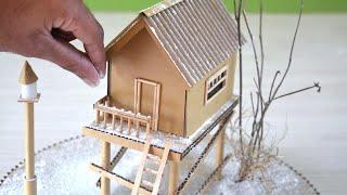 Wow DIY a small elevated cardboard house in a winter landscape