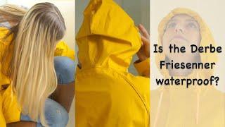 Blonde rainwear girl showering in her yellow PVC raincoat jeans and leather boots