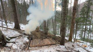 Building Underground Bushcraft Shelter for Survival in the Winter Forest A Dugout Under the Roots