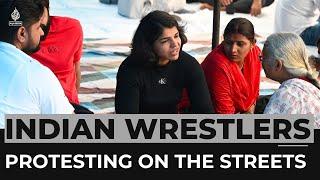 Why are top Indian wrestlers protesting on the streets?