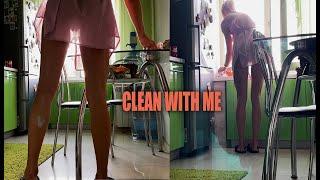 Fit girl cleaning in the kitchen in Transparent dress