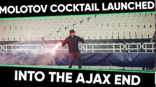 AEK ultras throw Molotov cocktail at Ajax fans during Champions League clash.