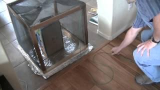 Does a Faraday Cage Need a Conductive Base When on the Ground?