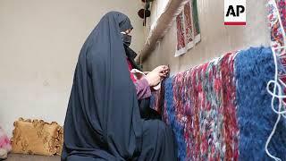 Facing bans Afghan women turn to carpet weaving