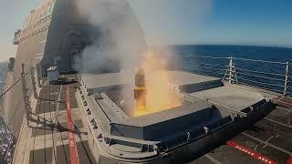 Littoral Combat Ship USS Montgomery fires Longbow Hellfire missiles against a land target.