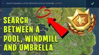 Search Between a Pool Windmill and an Umbrella - Fortnite Battle Pass Challenge