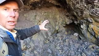 Geologist explores a lava tube cave at Craters of the Moon National Monument Idaho