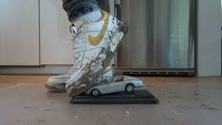 Trashed well worn Nike Air Force 1 AF1 stomp trample and destroy Ferrari model car