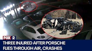 Three injured after Porsche flies through air crashes