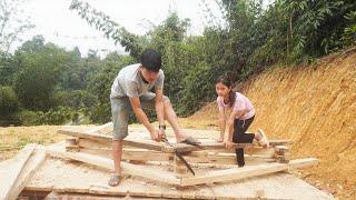 Build a new house - Poor girl building wooden house - Assembling the house column frame