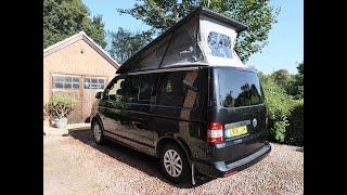 VW T5 Campervan with fixed toilet and rear elevation roof. The only way to go