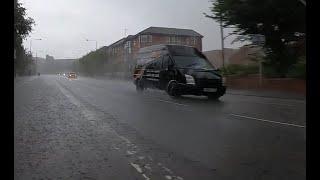 Cycling in Heavy Rain on Maryhill Road in Glasgow