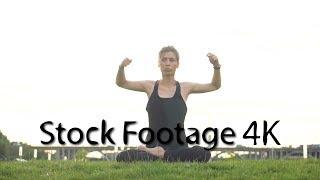 Girl performs yoga in park