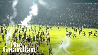 Teargas fired at Indonesian football match causing crowd crush