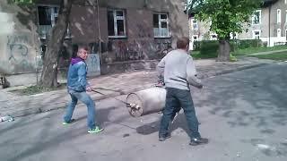 Harsh Russian men shoot from a trash can