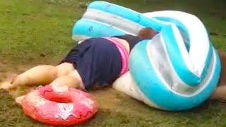 WOMAN SLIDES INTO A POOL  WATER SLIDE FAILS