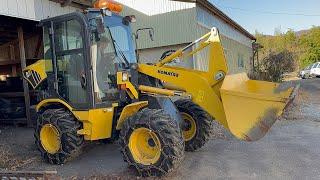 PUTTING THE CHAINS IN TIRE OF WHEEL LOADER