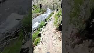 Riding a Brand New Trail on the Edge of a Cliff