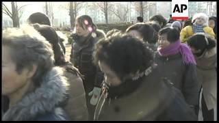 People crying on the streets after death of Kim Jong-Il