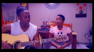 KINZA PLAYS JULIANA KANYOMOZIS KANYIMBE IN HER FIRST WEEK OF GUITAR TRAINING.