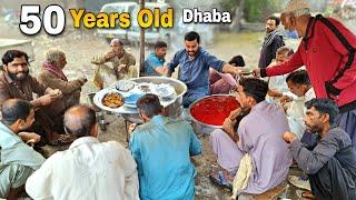 BREAKFAST IN PAKISTAN  TRADITIONAL MORNING STREET FOOD  VILLAGE DHABA MURGH CHANA CHOLAY