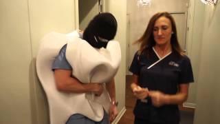 Dentist dressed as bad tooth slaps papers out of peoples hands