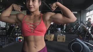 Asian muscle girl flexing