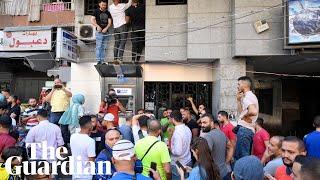 Customers storm banks to get their money in Lebanon