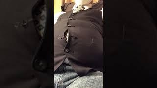 I inflated my belly and popped a button off my suit vest