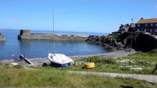 Craster village and Dunstanburgh Castle - holidays  by Northumberland Coast