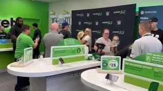 A sweet moment unfolds as Liv Morgan meets a tiny fan during the Cricket Wireless Meet and Greet