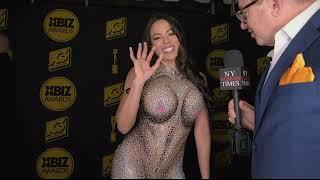 Luna Starr wears dress with a body print at the Xbiz Awards Red Carpet in Hollywood CA