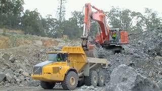Hitachi 670 LCH Excavator Load Dump Truck on Coal Mine Area