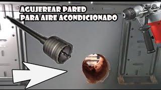 Agujero al exterior en la pared para el aire acondicionado con mecha copa