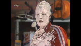 Two female contestants dunk their heads in giant pies on old Spanish show