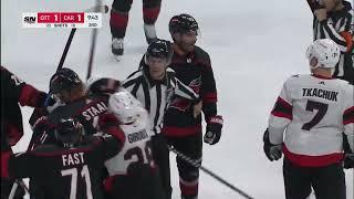 Scrum ensues after Mark Kastelic hit on Jordan Martinook