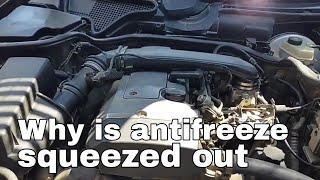 Why is antifreeze squeezed out of a car expansion tank?