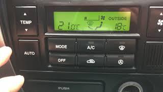 What is the difference between climate control and air conditioning in a car