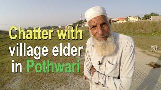 Talking in Pothwari with village elder  village life