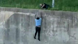 Video shows man dangling over then running across I 20 during police chase