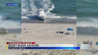 Witnesses capture video photos of moment boat runs ashore in Atlantic Beach