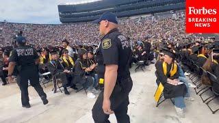 BREAKING Police Officers Remove Protesters From The University Of Michigan’s Commencement Ceremony