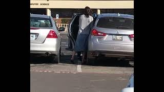 Girl trying to hold her skirt in the wind