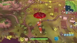 Search between a Pool Windmill and Umbrella  Fortnite