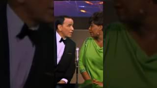 Ella Fitzgerald and Frank Sinatra delivering a performance together of “Going Out Of My Head” 